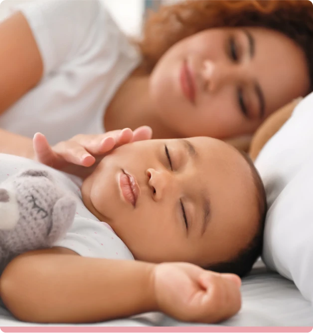 young african american woman her sleeping baby bed 1